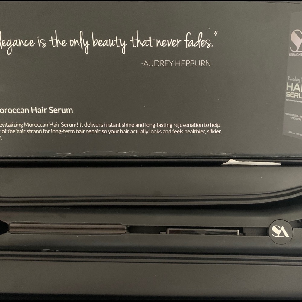 Black ceramic straightener. Gold collection.
